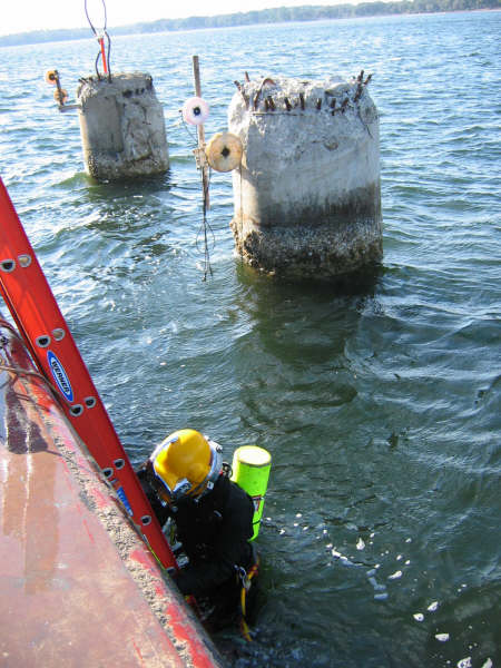 Diver entering saltwater with impact wrench and Cowan Chuck.jpg